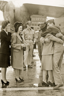 Louie embraces his mother, Louise, upon his post-war homecoming.